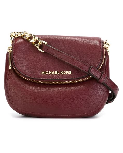 michael kors fold over clutch bag|More.